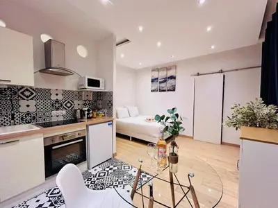 a kitchen and a living room with a glass table at Old Town Immersion-Breakfast-Central-Self Check-in in Nice