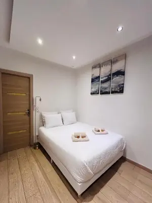a bedroom with a bed with two towels on it at Old Town Immersion-Breakfast-Central-Self Check-in in Nice