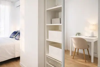 a mirror in a bedroom with a desk and a chair at Luxury Beachfront 2BR Promenade des Anglais in Nice