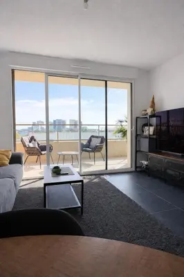 a living room with a view of the ocean at Luxury apartment with balcony & rooftop in Nice