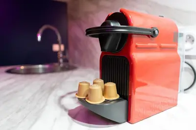 a red toaster sitting on top of a counter at Loft de 6 couchages, bord de mer à Nice in Nice