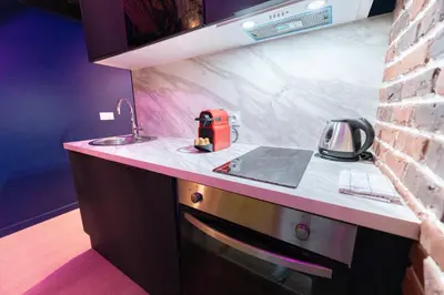 a kitchen with a sink and a counter top at Loft de 6 couchages, bord de mer à Nice in Nice