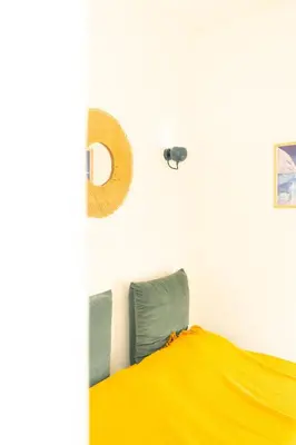 a hallway with white walls and a picture on the wall at A l'Élegance in Nice