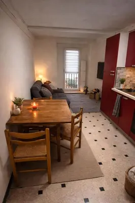 a kitchen with red cabinets and a sink at Old Nice appartement entier proche mer et plage et AC in Nice