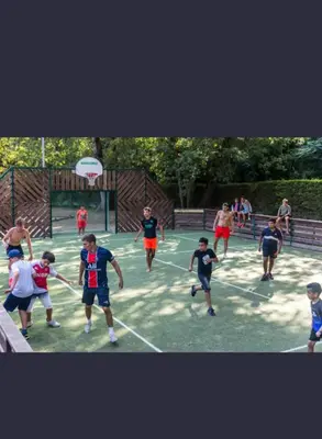 a group of young people playing a game of frisbee at Mobilhome Camping 4 étoiles in Cagnes-sur-Mer