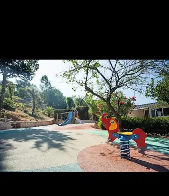 a playground with a slide in a park at Mobilhome Camping 4 étoiles in Cagnes-sur-Mer