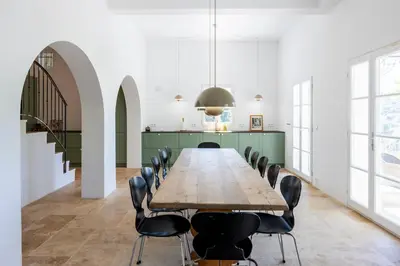 a large dining room with a long table and chairs at House on the Hill in Nice