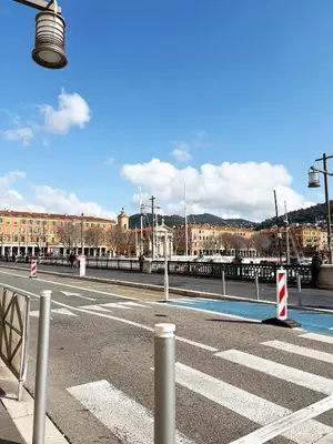 an empty street with a street light and buildings at Lympia Riviera Residence in Nice