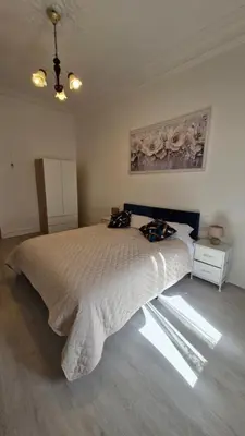 a bedroom with a large bed in a room at Chateauneuf in Nice
