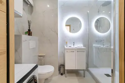 a bathroom with a toilet and a shower and a sink at B G Cocon Meyerbeer 2 - Grimaldi Promenade des Ang in Nice