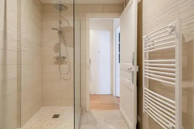 a bathroom with a shower and a glass door at Maison Bianchi - Durante - downtown in Nice