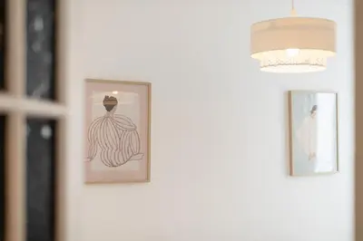 two framed pictures of a woman on a wall at Maison Bianchi - Durante - downtown in Nice