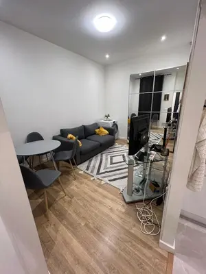 a living room with a couch and a table at Appartement vieux Nice in Nice