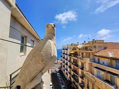 a statue of a seal looking out from a building at Nestor&Jeeves - LES AIGLES - Very close sea - Top floor - Luxurious in Nice
