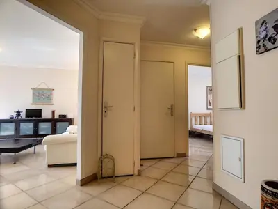 a hallway with two doors and a living room at Nestor&Jeeves - PALAIS RENOIR - By sea - Free parking in Nice