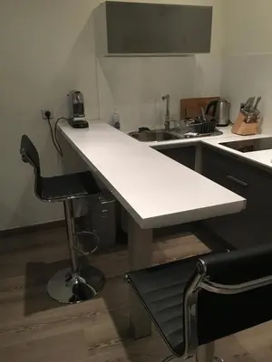 a white table in a kitchen with a sink at Gallo Comfort in Nice