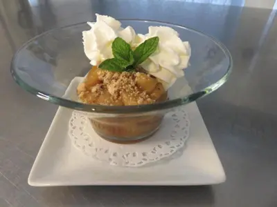 a dessert in a glass bowl on a plate at Hotel mon Soleil in La Gaude