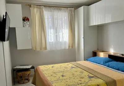 a bedroom with a bed and a window at Bellevue in Nice