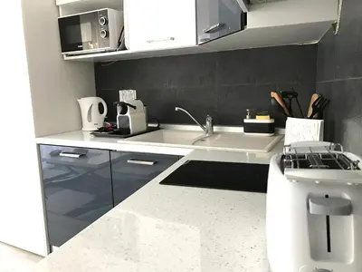 a kitchen with a sink and a counter top at Le Paradis Blue in Nice