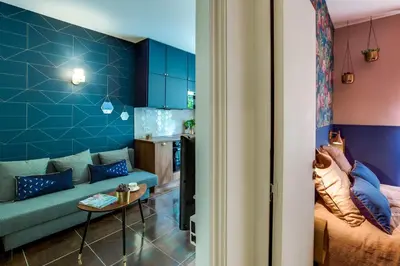 a bedroom with blue and white walls and a bed at CASA NISSARTE - Central near Train station - PARKING - confort & cosy- AC in Nice
