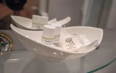 a white bowl with some products in it on a counter at Promotel in Carros