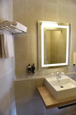 a bathroom with a sink and a mirror at Boutique Hotel & Spa la Villa Cap Ferrat in Saint-Jean-Cap-Ferrat