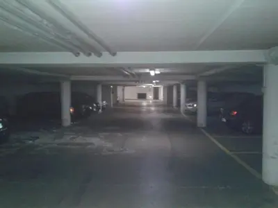 an empty parking garage with cars parked in it at Oranger in Nice