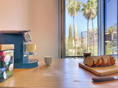 a table with a loaf of bread on a cutting board at Nestor&Jeeves - PALAIS MARIE PRESTIGE - Central - Close sea in Nice
