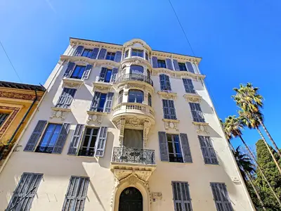 a tall white building with windows and a balcony at Nestor&Jeeves - PALAIS MARIE PRESTIGE - Central - Close sea in Nice