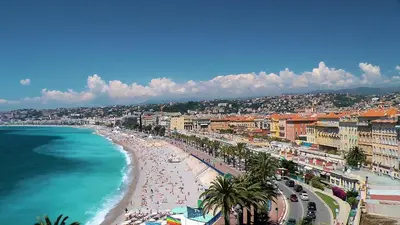 a view of a beach with people and the ocean at Nestor&Jeeves - PALAIS DE FRANCE - Central - Sea front in Nice