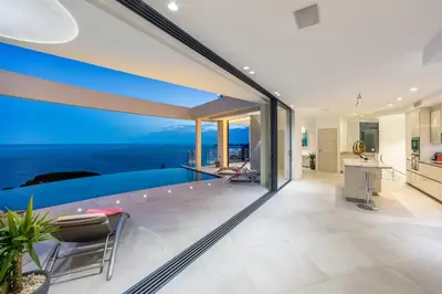 a house with a swimming pool with a view of the ocean at Villa Paradise in Èze