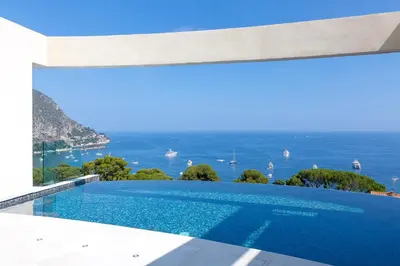 a swimming pool with a view of the ocean at Villa Paradise in Èze