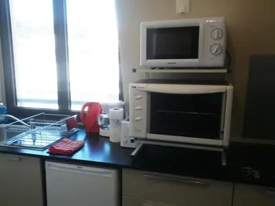 a microwave oven sitting on top of a kitchen counter at Nice Centre, Magnifique Studio Proche Mer in Nice