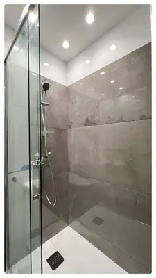a bathroom with a shower with a glass door at Maison de Côte - Felice in Nice