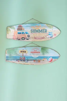 two surfboards are hanging on a wall at Cosy apartment Promenade des Anglais in Nice