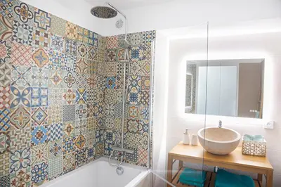 a bathroom with a tub and a sink and a mirror at Cosy apartment Promenade des Anglais in Nice