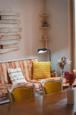 a living room with a couch and a table at La Maïoun Guesthouse in Nice