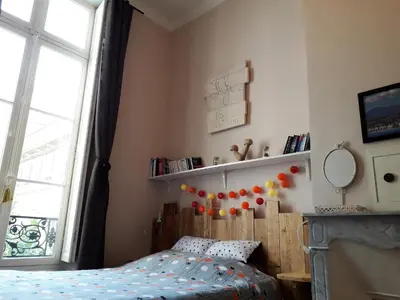 a bedroom with a bed and a window at La Maïoun Guesthouse in Nice