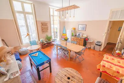 an overhead view of a living room with a table and chairs at La Maïoun Guesthouse in Nice