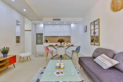 a living room with a couch and a table at MY CASA - FRANCE 82 TP -1 min from the Sea - Terrace - Parking in Nice