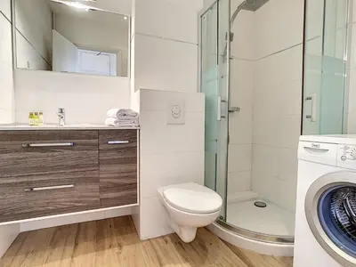 a bathroom with a toilet and a glass shower at Nestor&Jeeves - GIBRALTAR TERRASSE - Central - By sea - Pedestrian zone in Nice