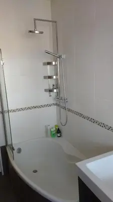 a bathroom with a bath tub and a shower at Val Roya Terrasse in Nice