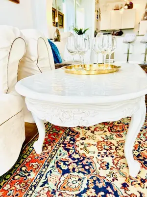 a white coffee table with wine glasses on top of a rug at Endless Stunning Mediterranean Sea Views Promenade Des Anglais in Nice