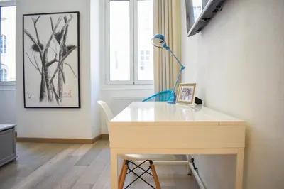 a white desk in a room with a window at Résidence Barla in Nice