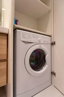 a white washer and dryer in a kitchen at GRAND HÔTEL Golden Square 3 min to Beach Green Corridor View AC in Nice