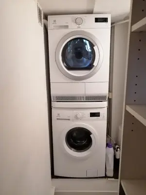a washing machine and a dryer in a room at CondoNice in Nice