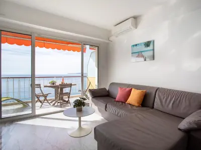 a white room with a bed and a window at Apartment L'Angelina-1 by Interhome in Cros-de-Cagnes