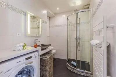 a bathroom with a washing machine and a shower at MY CASA - JOFFRE 9 - Near Masséna Square - Terrace in Nice