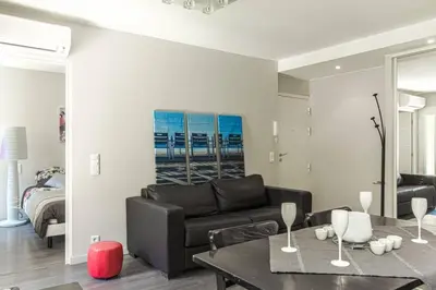 a living room with a couch and a table at MY CASA - JOFFRE 9 - Near Masséna Square - Terrace in Nice
