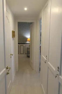 a hallway with a hallway leading to a room at La Reale in Villefranche-sur-Mer